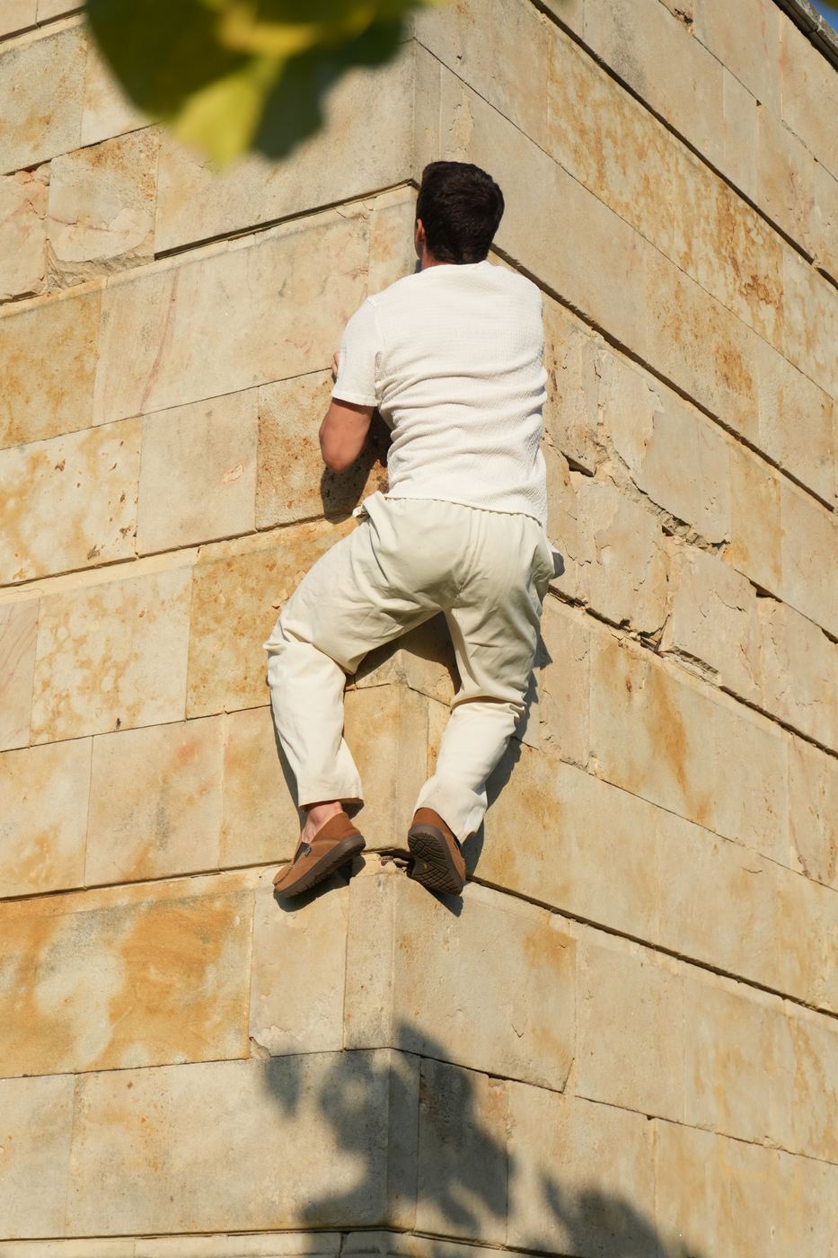 Climbing a bare stone wall